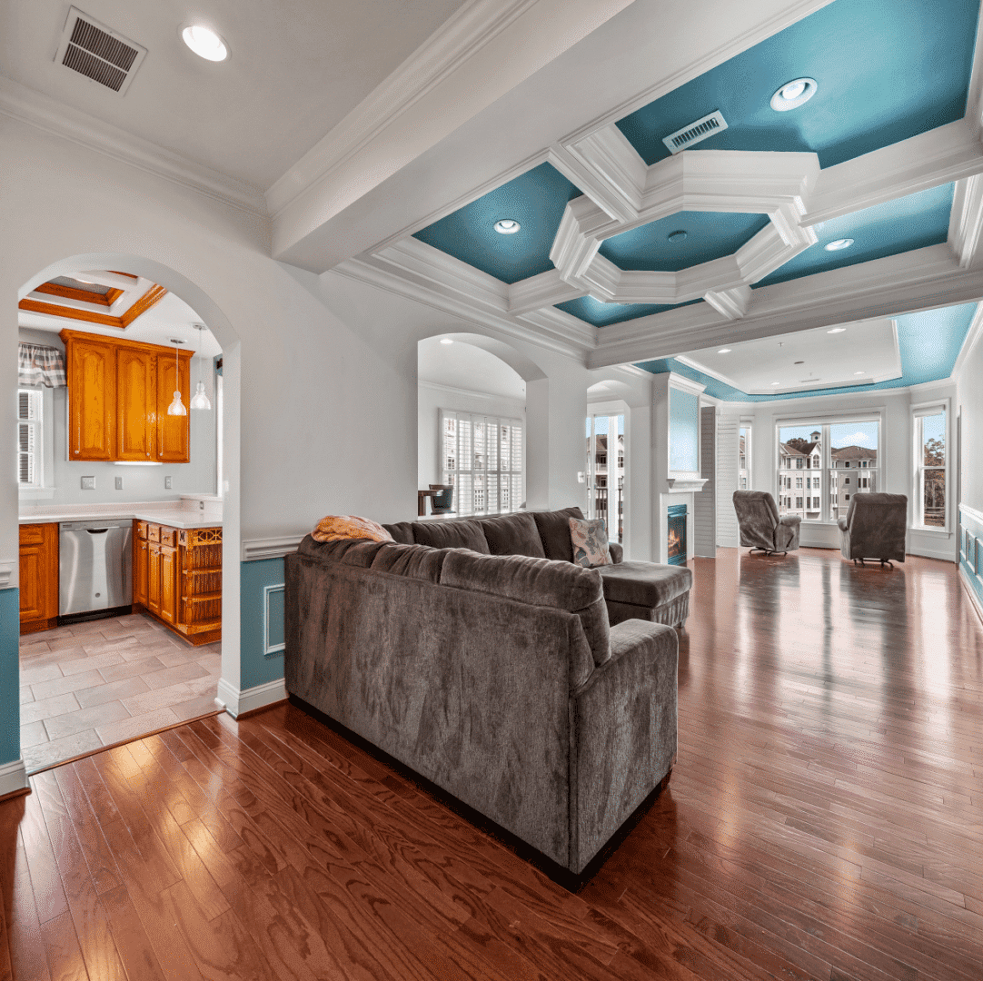 Spacious living room with teal coffered ceiling